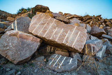 Large deposits of stone materials near a mining quarryの写真素材