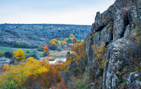 Aktovsky Canyon, Ukraine. Autumn trees and large stone boulders aroundの写真素材