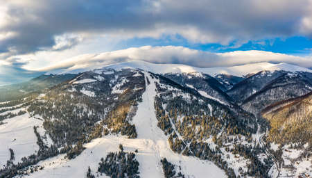 Magical winter panorama of beautiful snowy slopes