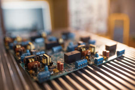 Close-up green embedded microcircuits are stacked on test plate to prepare for the further...