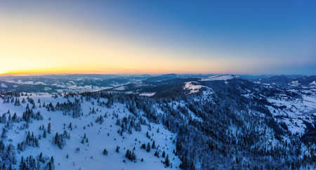 Wonderful landscapes of the Carpathian mountains covered with the first snow in Ukraine near the village of Pylypetsの写真素材