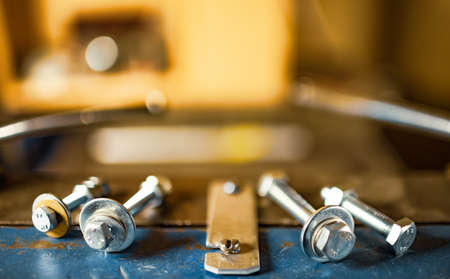 Metal chrome bolts and nuts on manual flexible massive machineの写真素材