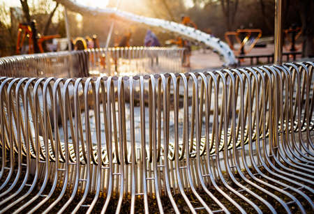 Close-up street bench metal pipes arranged parallelの写真素材