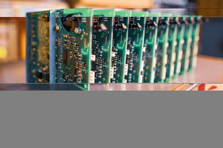 Close-up electric green embedded microcircuits in productionの写真素材