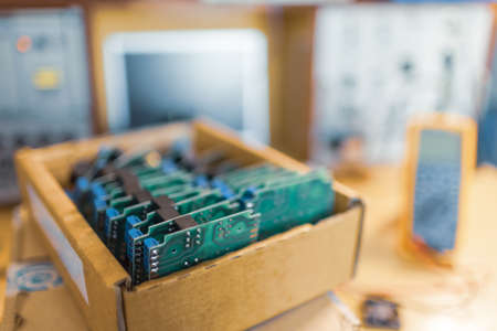Close-up electric green embedded microcircuits in productionの写真素材