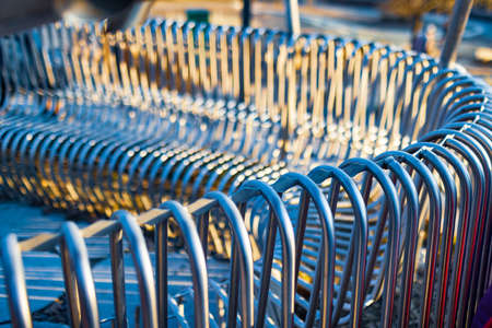 Close-up street bench metal pipes arranged parallelの写真素材