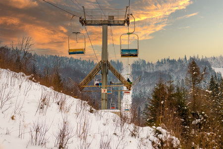 Funiculars are located among hilly in mountainsの写真素材