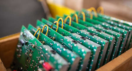 Set of chips on microcircuit board for contemporary TFT displays in cardboard box in plant...