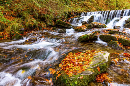 Beautiful Waterfall Shipot in the autumn forest of the Carpathian Mountainsの写真素材
