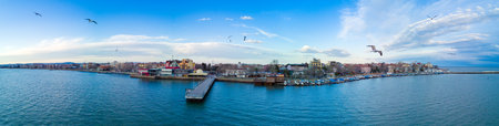Panoramic bird's eye view over small ancient resort town of Pomorie with old European small houses...