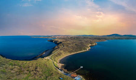 A bird's eye view panorama of a wild sandy dry grass shore washed by a deep calm evening Black sky in Bulgariaの写真素材