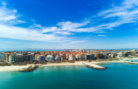 Panoramic bird's eye view over small ancient resort town of Pomorie with old European small houses and quiet calm empty streets, washed by the sea spring turquoise Black Sea on clear day in Bulgariaの写真素材