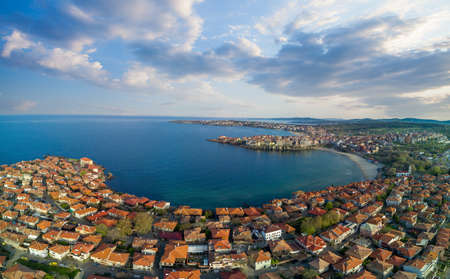 Panoramic bird's eye view over small ancient resort town of Pomorie with old European small houses...