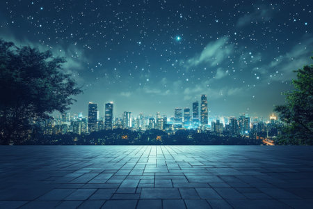 A stunning city skyline is visible under a starry sky, showing bright lights and silhouettes of buildings.の写真素材