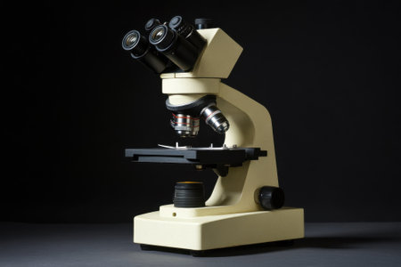 A laboratory microscope is positioned for examining samples, highlighting its advanced optics and structure.の写真素材