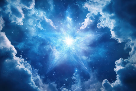 A luminous star radiates light amidst swirling blue clouds on a clear night sky.の写真素材