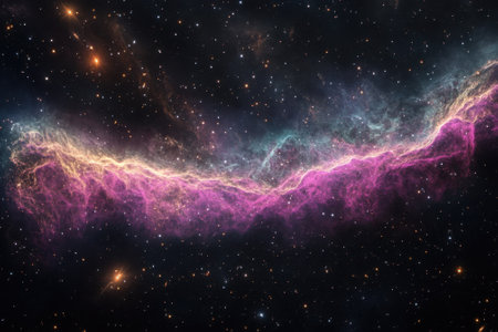 Bright pink and blue hues illuminate a magnificent nebula, revealing the wonders of outer space.の写真素材