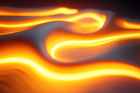 Bright orange streams of molten lava flow across a dark surface, showing the intense heat and movement.の写真素材