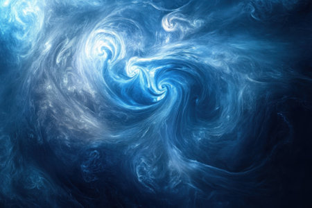 A stunning display of swirling blue clouds captures the essence of cosmic beauty in a vast expanse.の写真素材