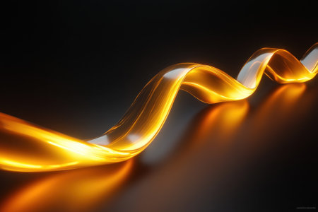 A smooth golden light wave curves elegantly, creating a contrast with the dark backdrop, offering a mesmerizing view.の写真素材