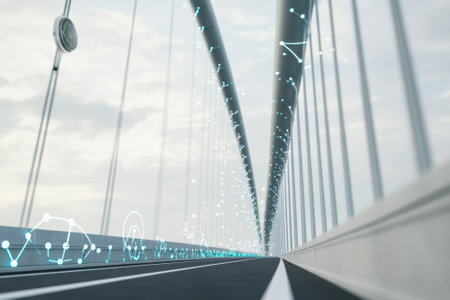 A modern bridge showcases sleek design and digital elements, set against a cloudy sky during daylight.の写真素材