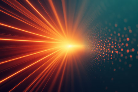 Bright orange light rays radiate outward, creating an energetic atmosphere against a dark background.の写真素材