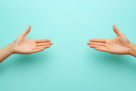 Two hands open and extended towards each other, creating a sense of connection and anticipation.の写真素材