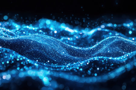 Bright blue waves of light flow gracefully, creating a stunning visual effect in a dark backdrop.の写真素材
