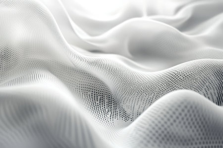 A gentle wave of white fabric creates a soft and smooth texture, illuminated by natural light.の写真素材