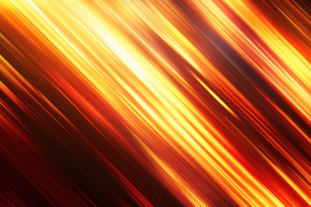 Vibrant hues of orange and yellow streak across a dark background, creating a sense of motion and warmth.の写真素材