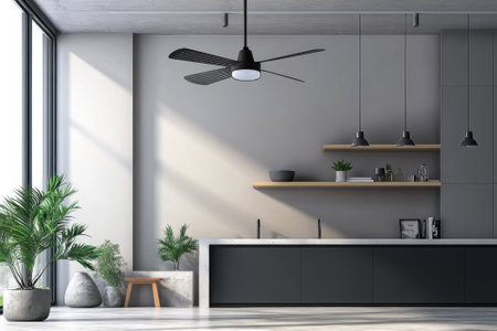 Bright kitchen features a minimalist design with a black island, wooden shelves, and lush greenery throughout.の写真素材