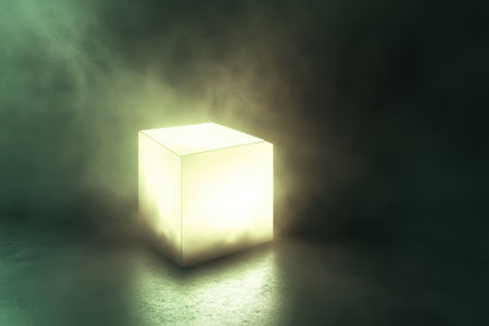 A luminous cube sits isolated in a dim space, surrounded by swirling mist and deep shadows, evoking intrigue.の写真素材