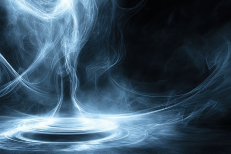 Delicate tendrils of smoke rise and twist, forming intricate shapes against a dark backdrop, evoking an ethereal feel.の写真素材