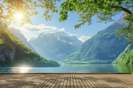 Beautiful landscape featuring mountains and a calm lake surrounded by lush trees on a sunny day.の写真素材