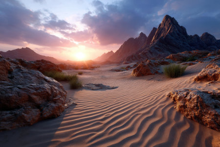 Vibrant sunset casts colorful hues across a desert landscape with rugged mountains and rippled sand.の写真素材