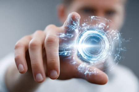 A person reaches out to touch a luminous, swirling holographic display emitting blue light in a modern environment.の写真素材