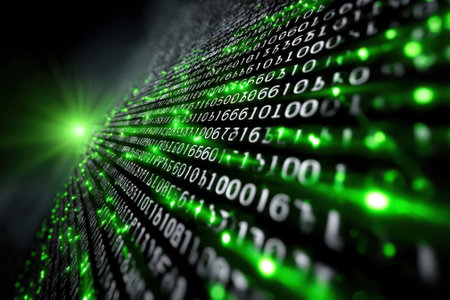 A vibrant display of green binary code illuminates a dark background, creating a high-tech atmosphere.の写真素材