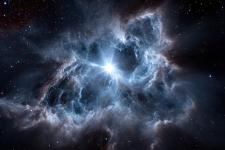 A luminous star bursts forth from a colorful nebula, showing intricate clouds of gas and dust in space.の写真素材