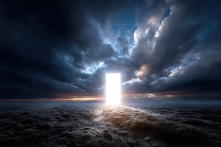 A bright, glowing door stands alone in a mystical landscape, surrounded by dark clouds at twilight.の写真素材