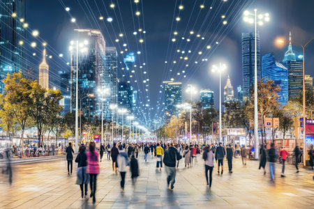 A bustling city street filled with pedestrians enjoying the nightlife beneath twinkling lights.の写真素材