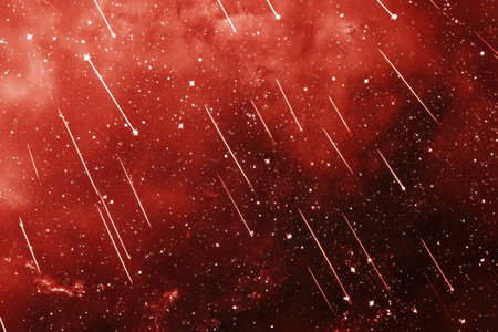 Bright meteors streak across a striking red astronomical backdrop, creating a celestial spectacle.の写真素材