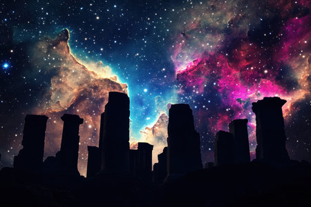Stone structures stand silhouetted against a dazzling cosmic backdrop filled with vibrant colors and stars.の写真素材