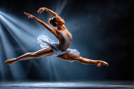 A high-speed shot of a dancer in mid-leap, captured with a telephoto lens in a spotlight, showing the power and grace of human movement, ultrarealistic photo --ar 3:2 --raw --profile nk3i4wf --stylize 250 --v 7 Job ID: c6ac8c50-2b4e-4d9e-90e9-3043c831e1d4の写真素材