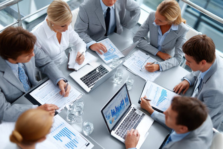 Business team reviewing financial data during a meetingの写真素材