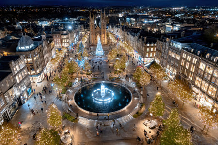 A cityscape decorated with Christmas lights at night seen from aboveの写真素材