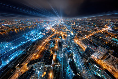 An aerial zoom blur view of a cityscape at night with light trailsの写真素材