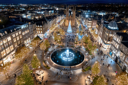 A cityscape decorated with Christmas lights at night seen from aboveの写真素材