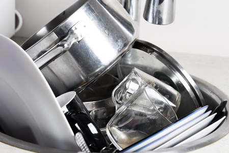 dirty dishes in the sinkの写真素材