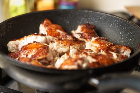 Fried Chicken Cooking in an pan closeupの写真素材