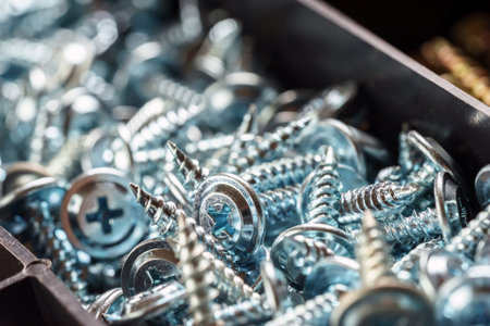 Screws in plastic box closeup background